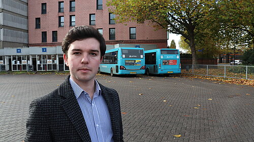 Alex Wagner in front of the Bus Station campaigning against high car parking charge rises