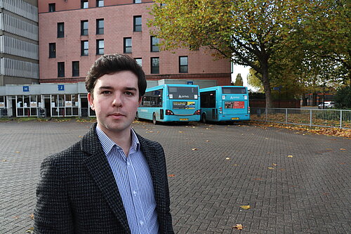 Alex Wagner in front of the Bus Station campaigning against high car parking charge rises